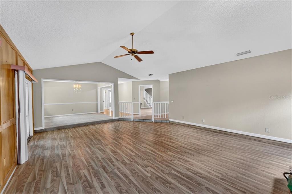 16 Fox Hollow Drive Ormond Beach, FL 32174 - Photo 7 of 38 a view of empty room with wooden floor and fan