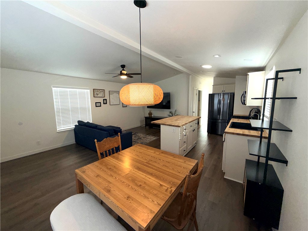 449 West Tefft Street, Unit 13 Nipomo, CA 93444 - Photo 11 of 22 a living room with furniture a flat screen tv and kitchen view