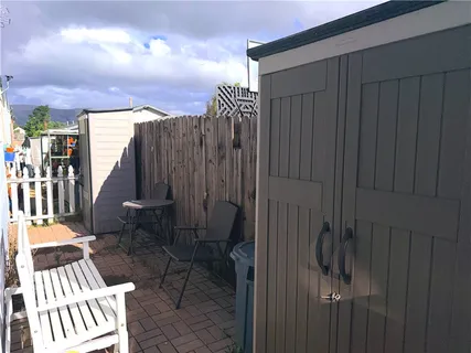a view of balcony with wooden floor and bench