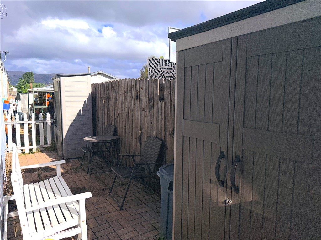 449 West Tefft Street, Unit 13 Nipomo, CA 93444 - Photo 18 of 22 a view of balcony with wooden floor and bench