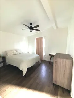 a bedroom with a bed and window