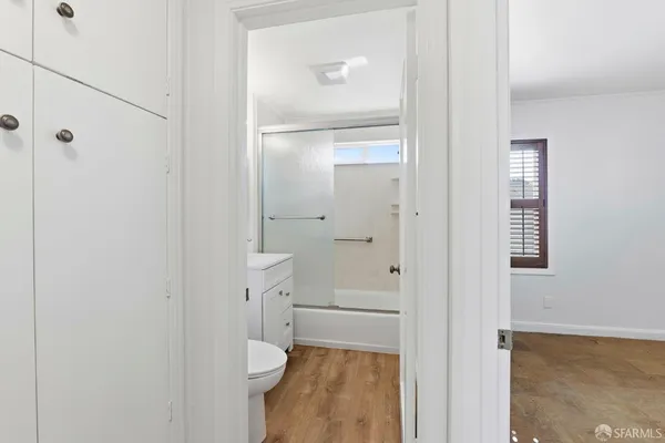 a bathroom with a glass shower door