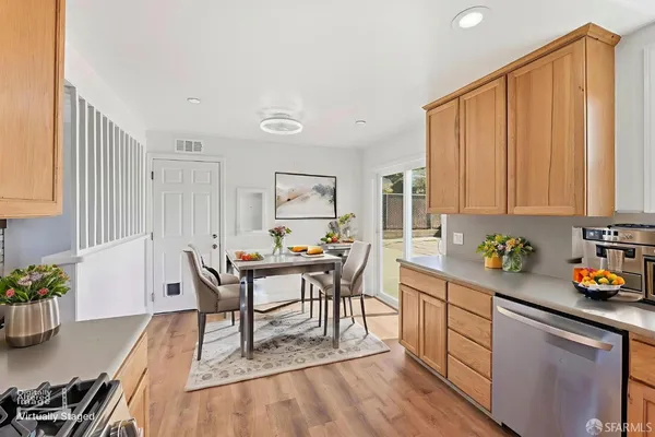 a view of a dining room with furniture and wooden floor
