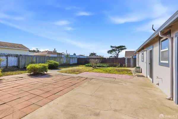a view of a house with swimming pool and a yard