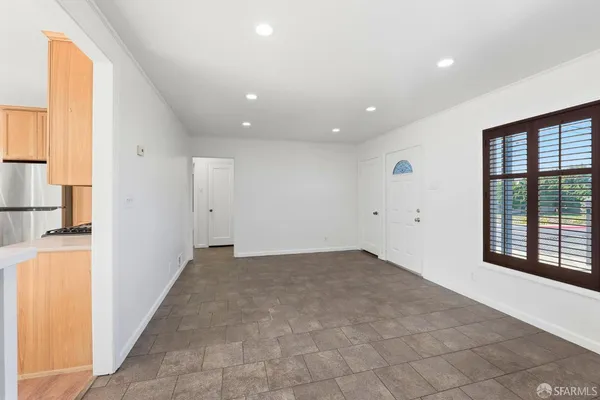 a view of an empty room with a window
