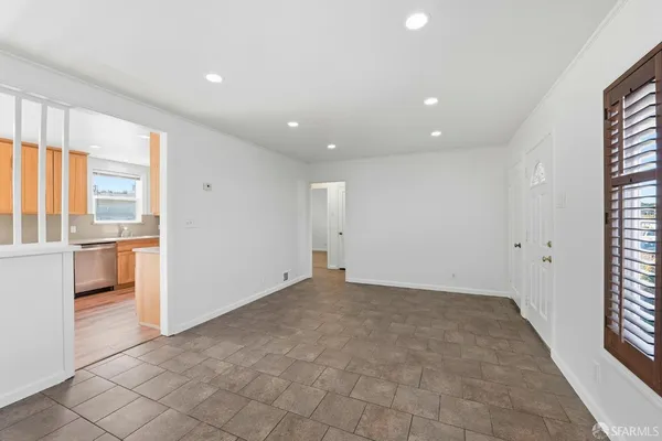 a view of an empty room with a window