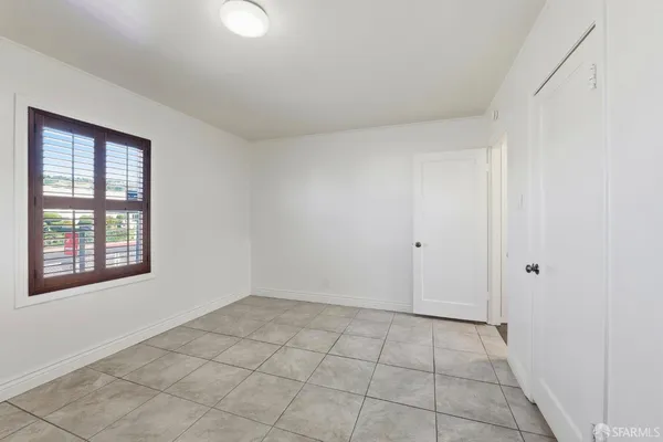 a view of an empty room with a window