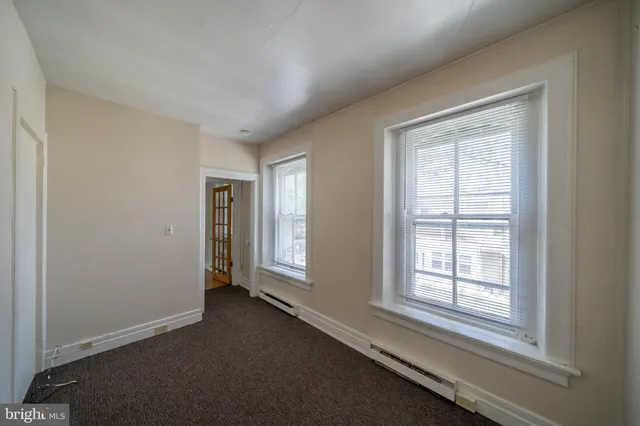 an empty room with windows