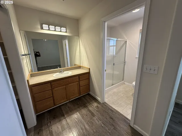 a bathroom with a double vanity sink and mirror