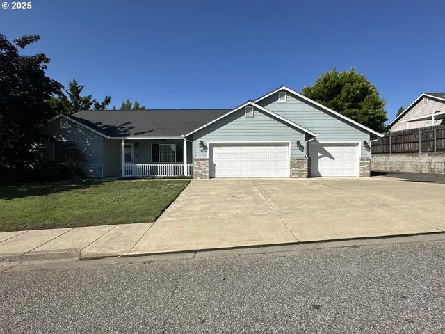 front view of house next to a yard