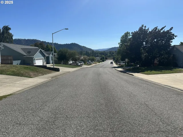 a view of a city with mountains in the background
