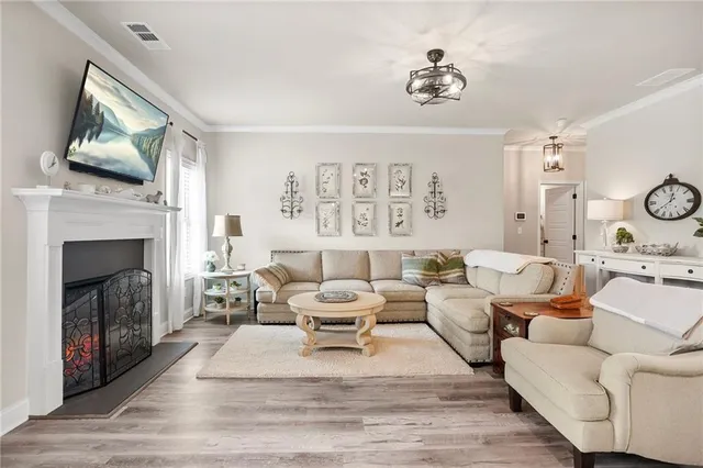 a living room with lots of furniture and kitchen view