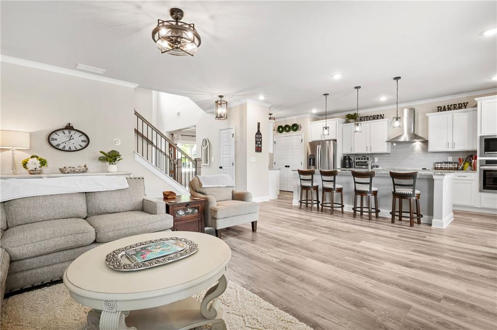 2326 Britt Street Grayson, GA 30017 - Photo 16 of 53 a living room with lots of furniture and kitchen view