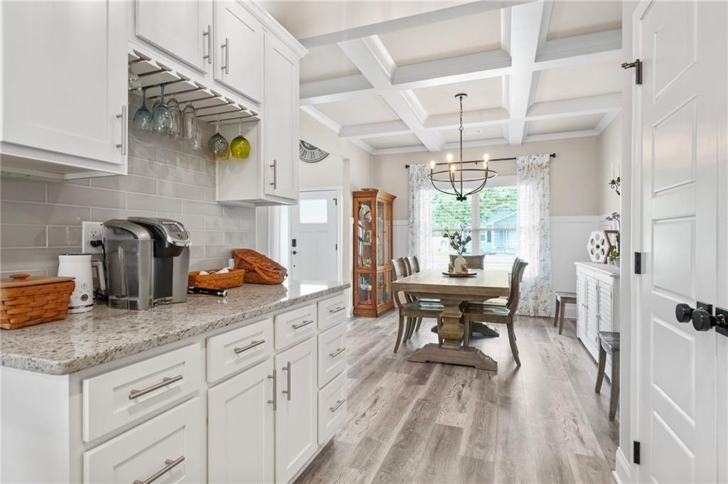 2326 Britt Street Grayson, GA 30017 - Photo 18 of 53 a kitchen with sink cabinets and dining table