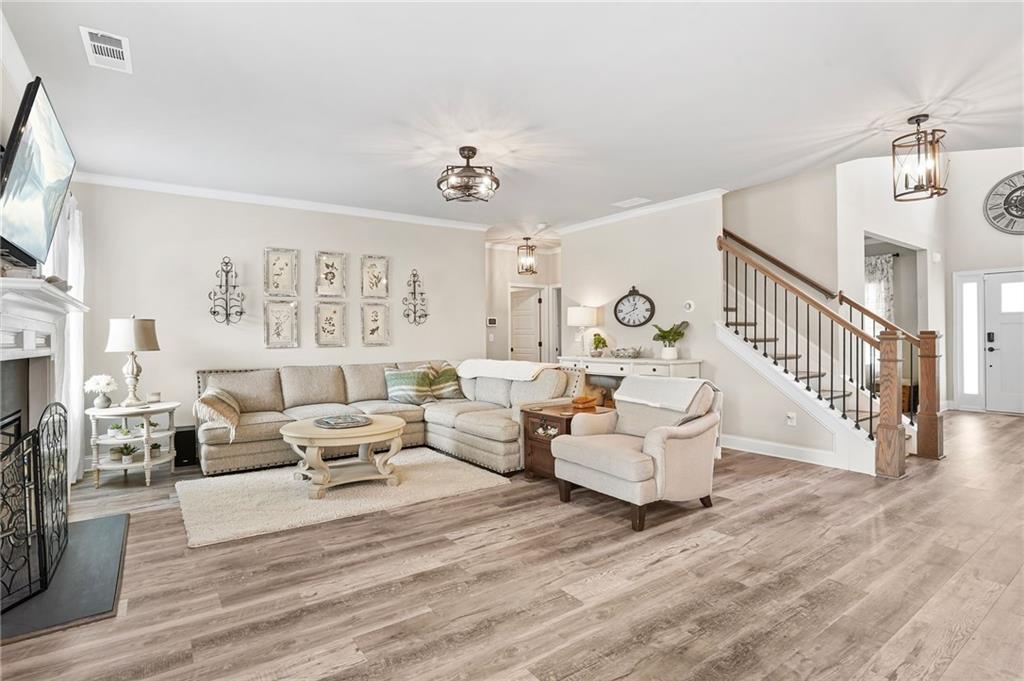 2326 Britt Street Grayson, GA 30017 - Photo 19 of 53 a living room with fireplace furniture and a flat screen tv