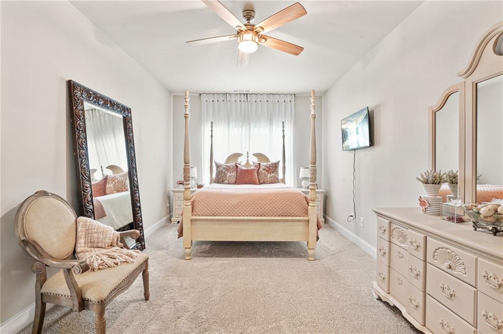 2326 Britt Street Grayson, GA 30017 - Photo 20 of 53 a bedroom with a bed chair and dresser