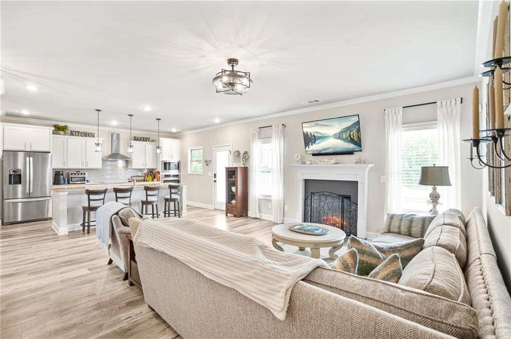 2326 Britt Street Grayson, GA 30017 - Photo 2 of 53 a living room with furniture and a fireplace