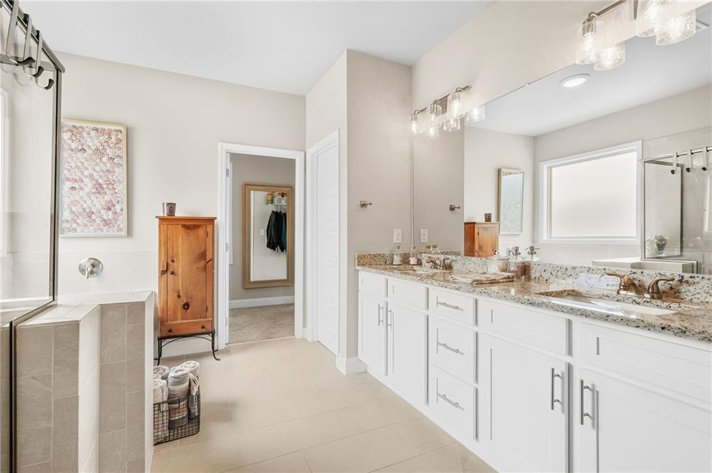 2326 Britt Street Grayson, GA 30017 - Photo 32 of 53 a bathroom with a double vanity sink double vanity and a mirror
