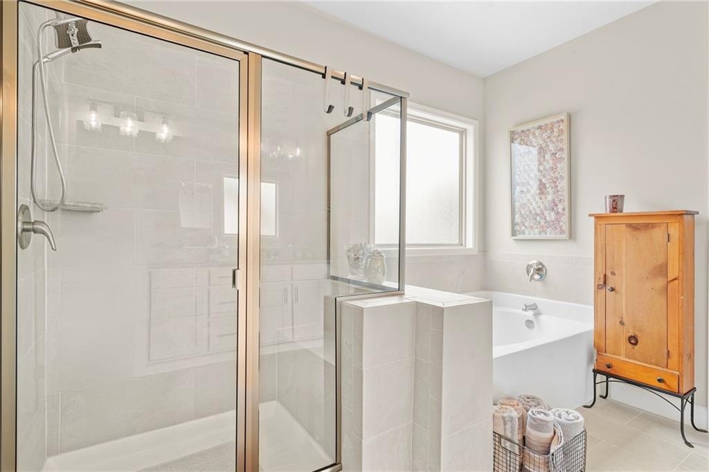 2326 Britt Street Grayson, GA 30017 - Photo 33 of 53 a bathroom with a bathtub shower and a sink