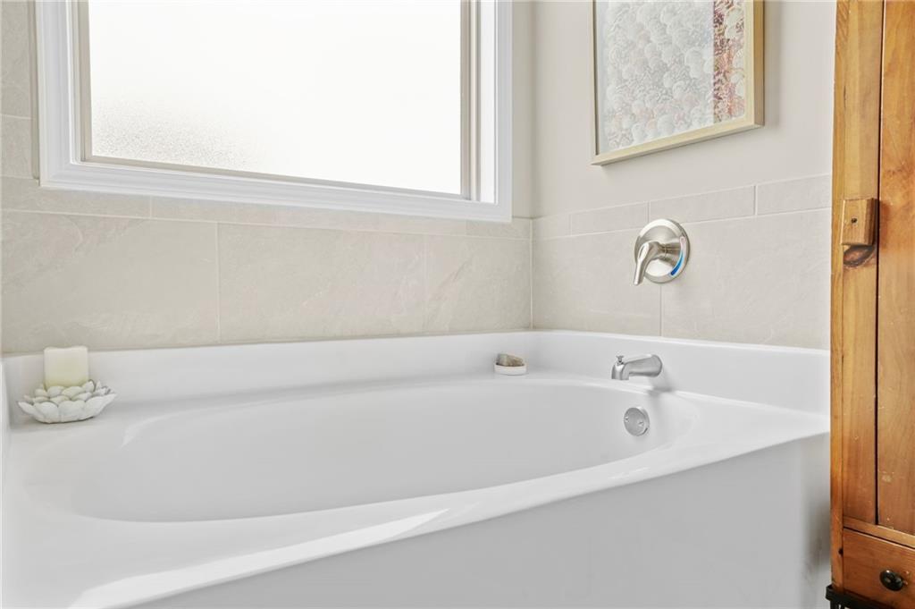2326 Britt Street Grayson, GA 30017 - Photo 34 of 53 a bathroom with a bathtub