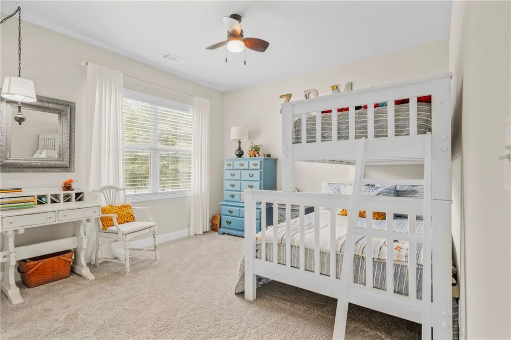 2326 Britt Street Grayson, GA 30017 - Photo 40 of 53 a bedroom with furniture and a window