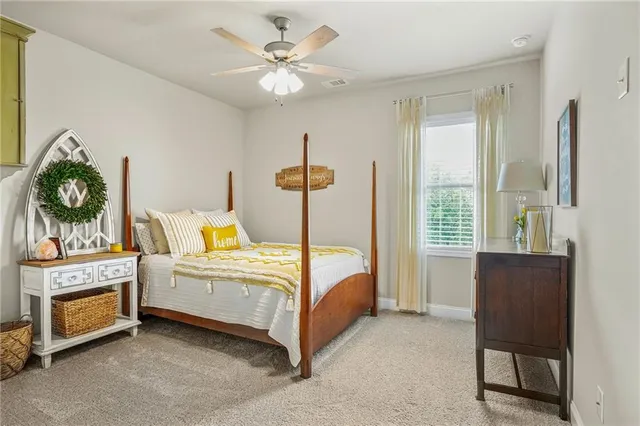 a bathroom with a shower curtain and a toilet