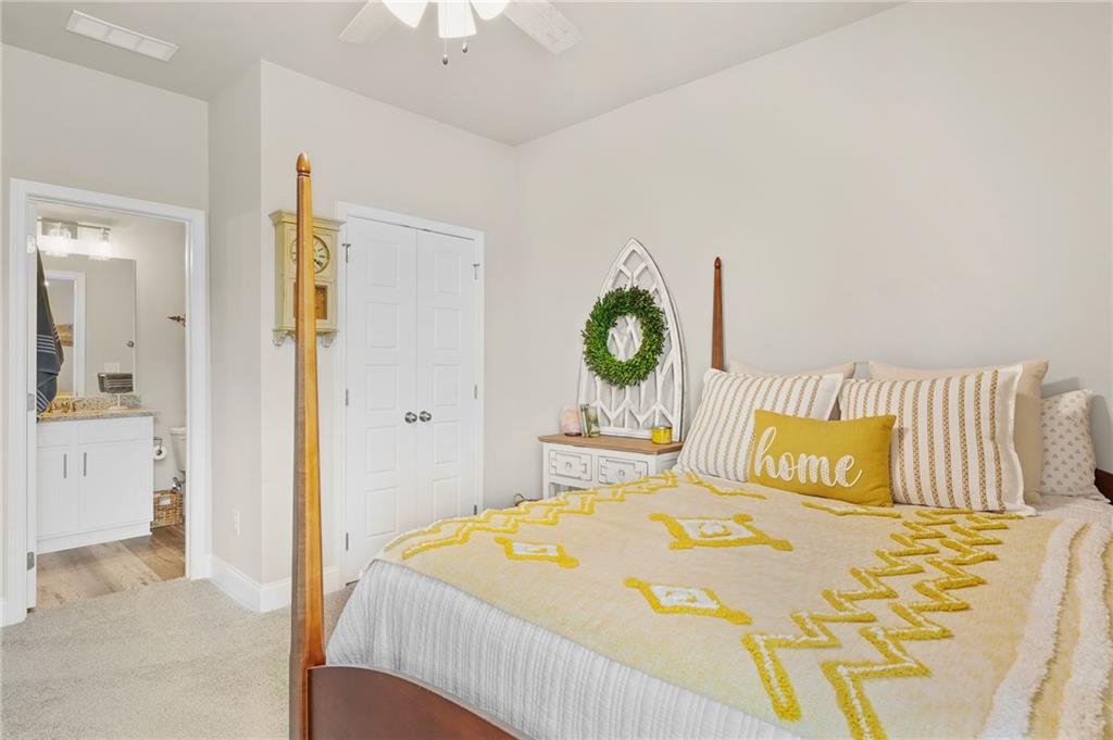 2326 Britt Street Grayson, GA 30017 - Photo 45 of 53 a bedroom with a bed and a cabinets