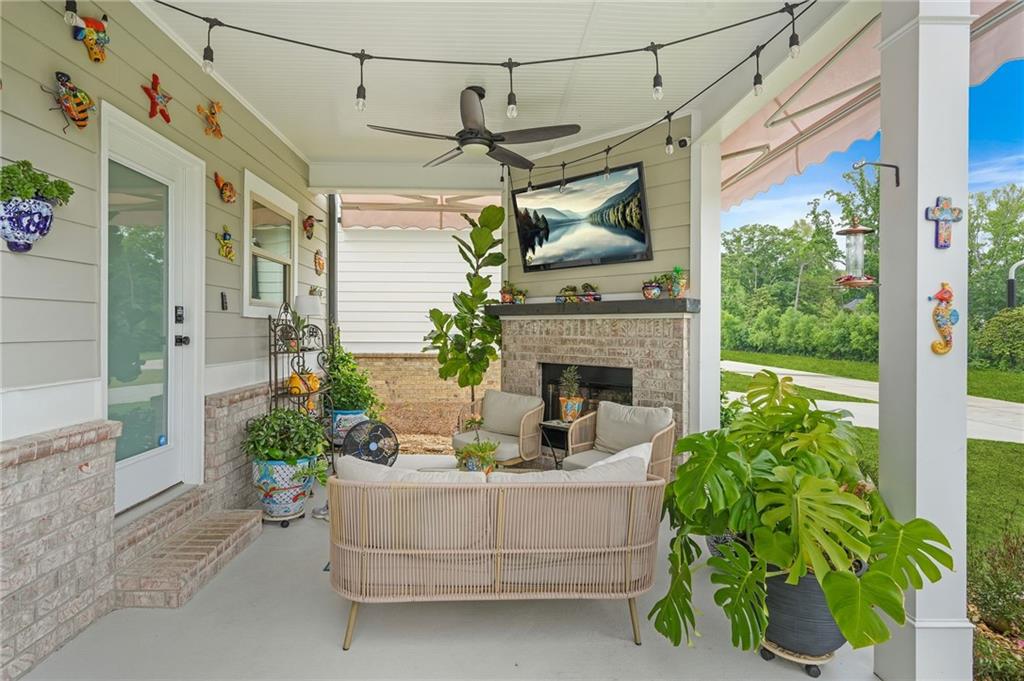 2326 Britt Street Grayson, GA 30017 - Photo 49 of 53 a living room with furniture and a fireplace