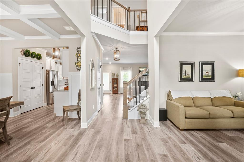 2326 Britt Street Grayson, GA 30017 - Photo 7 of 53 a living room with furniture and a wooden floor