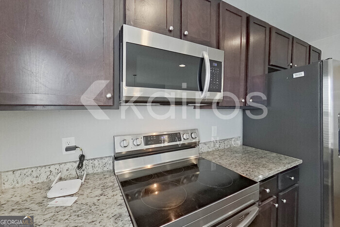 101 St Matthew Way Springfield, GA 31329 - Photo 7 of 30 a kitchen with a sink a stove and cabinets