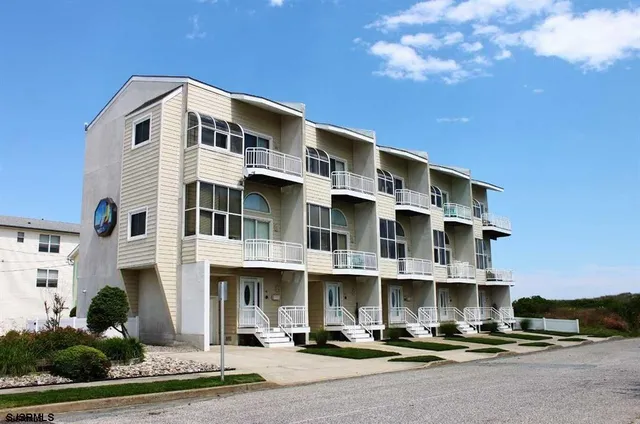 a front view of a building with street view