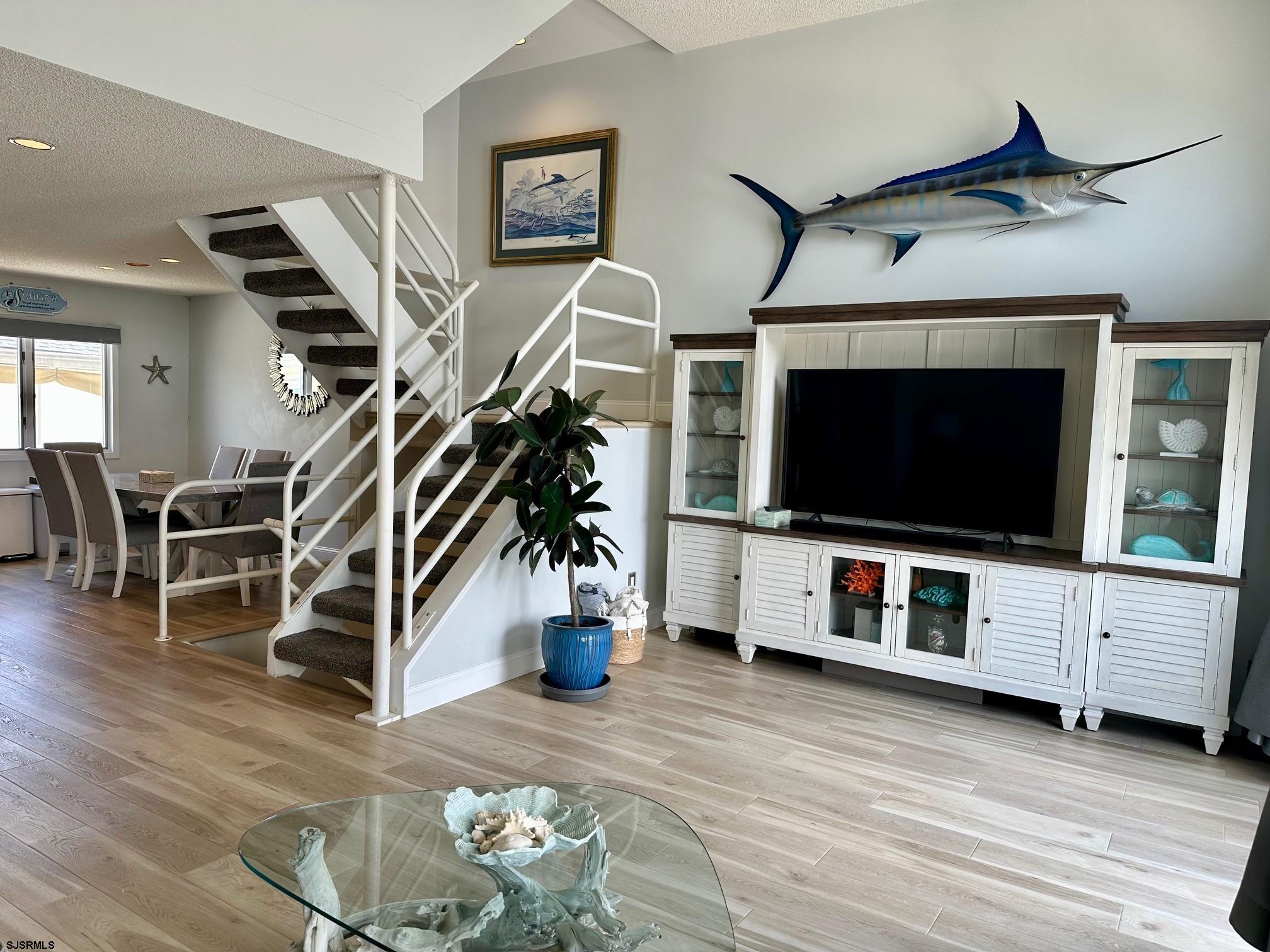 305 4th Street South, Unit 305 Brigantine, NJ 08203 - Photo 14 of 45 a living room with furniture and a flat screen tv