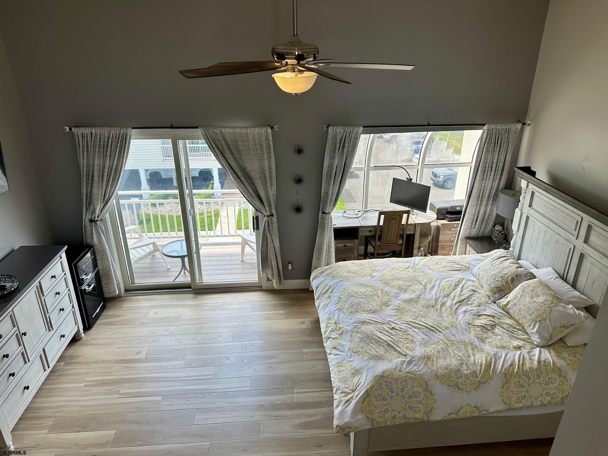 305 4th Street South, Unit 305 Brigantine, NJ 08203 - Photo 31 of 45 a bed sitting in a bedroom next to a window