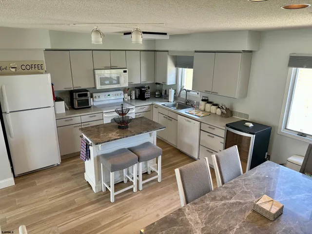 a view of a ocean with a building in the background