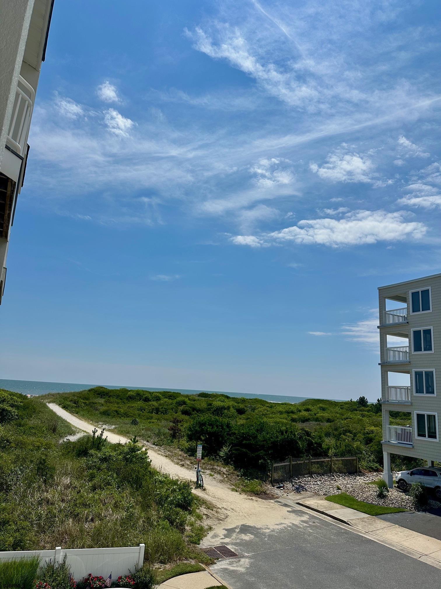 305 4th Street South, Unit 305 Brigantine, NJ 08203 - Photo 41 of 45 a view of a ocean with a building in the background