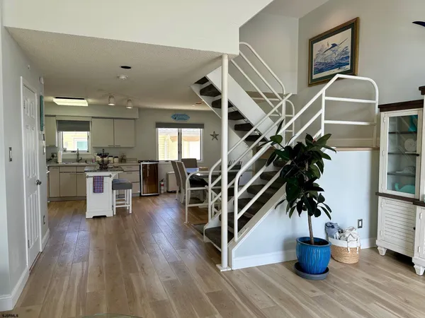 a view of an entryway with wooden floor