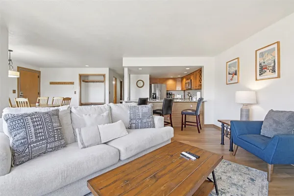 a living room with furniture or couch and wooden floor