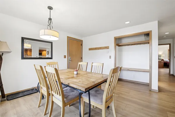 a view of a dining room with furniture window and wooden floor