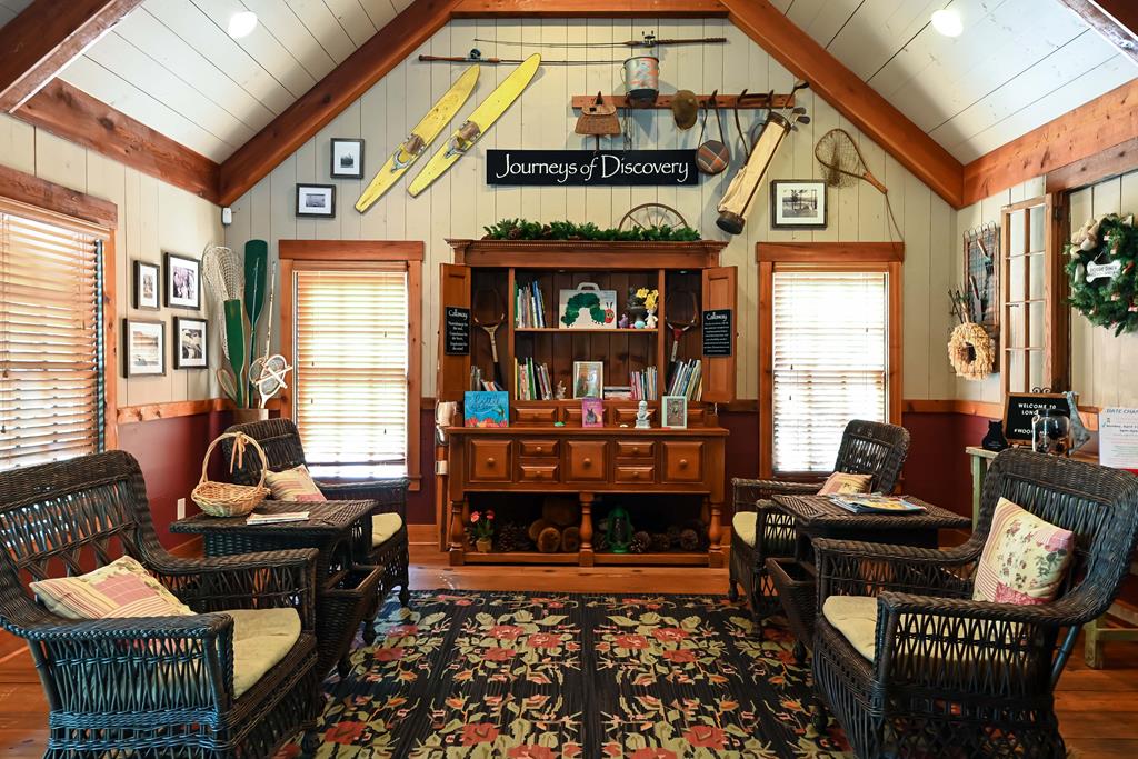 283 White Oak Road Pine Mountain, GA 31822 - Photo 17 of 19 a living room with furniture a fireplace and a large window
