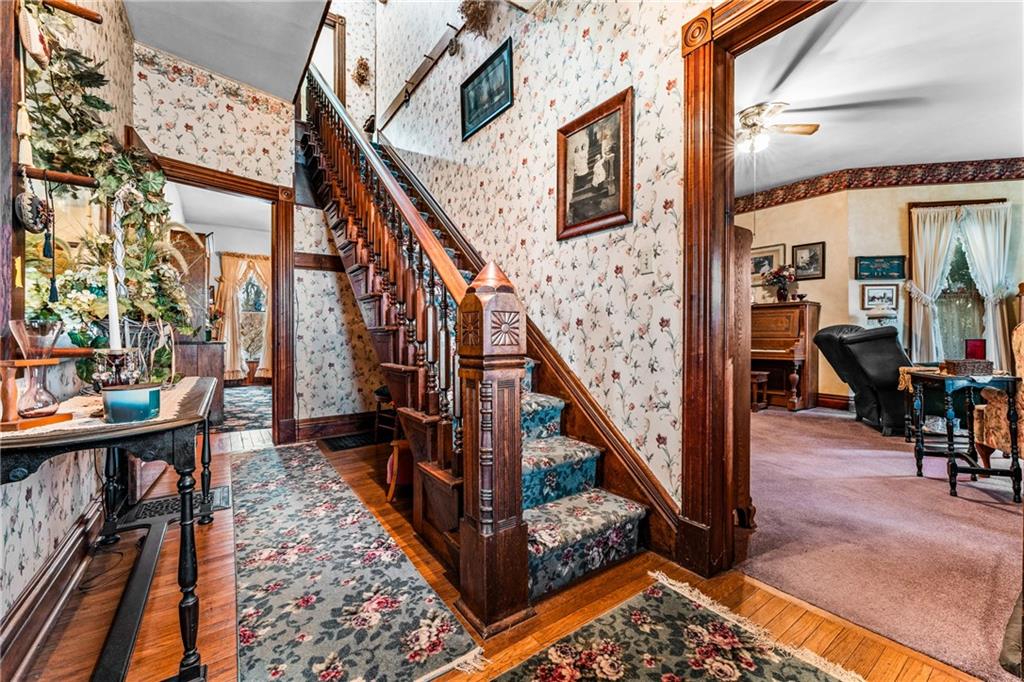 572 Mercer-New Wilmington Road Mercer, PA 16137 - Photo 5 of 39 a view of entryway livingroom and hall with wooden floor