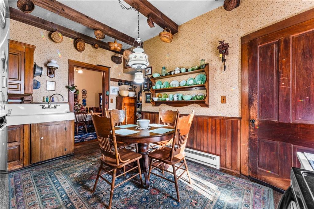 572 Mercer-New Wilmington Road Mercer, PA 16137 - Photo 7 of 39 a view of a dining room with furniture and chandelier
