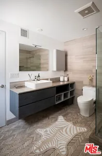 a bathroom with a shower and toilet
