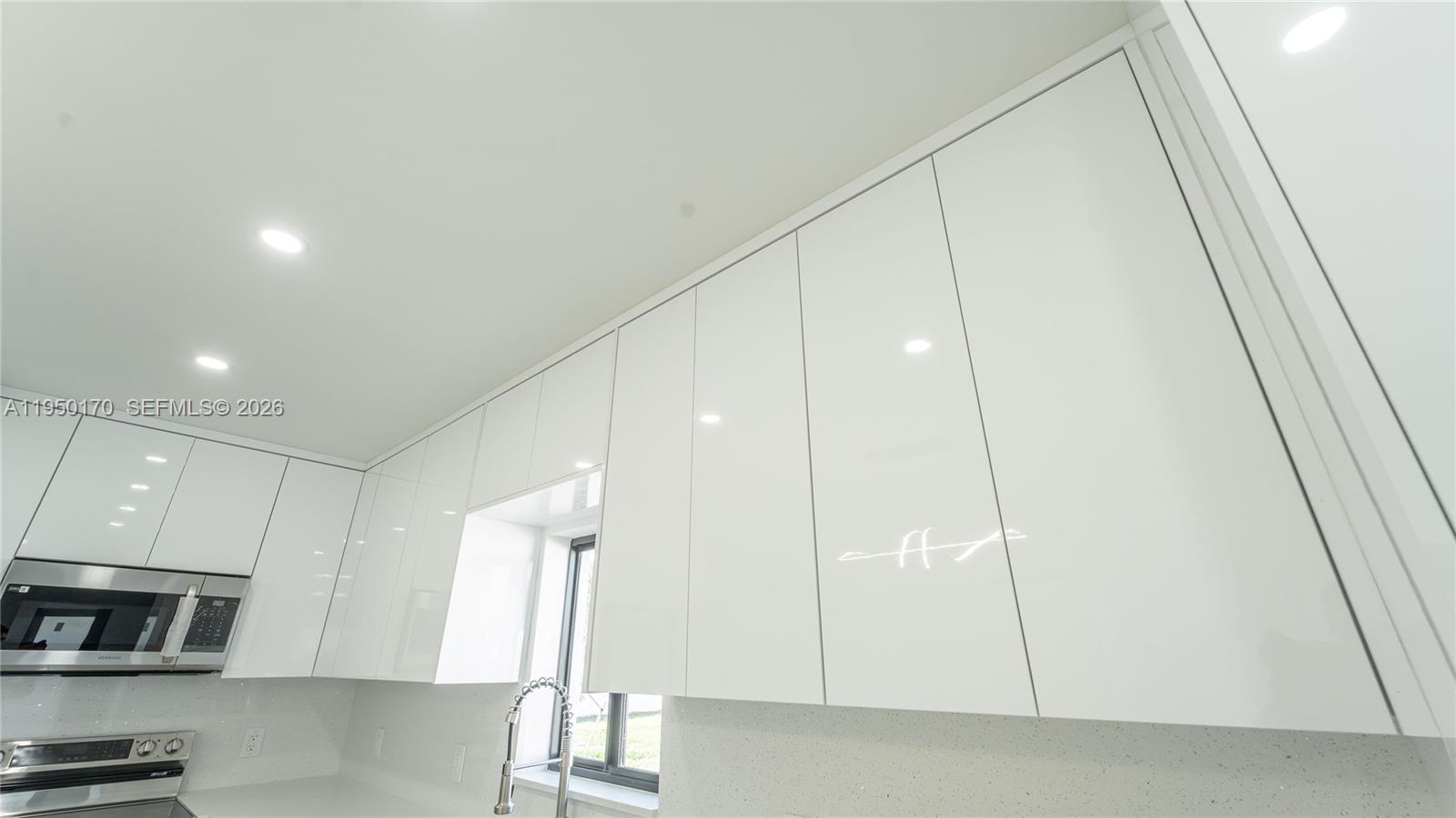 22840 Southwest 122nd Place Miami, FL 33170 - Photo 18 of 36 a kitchen with stainless steel appliances a refrigerator and a microwave