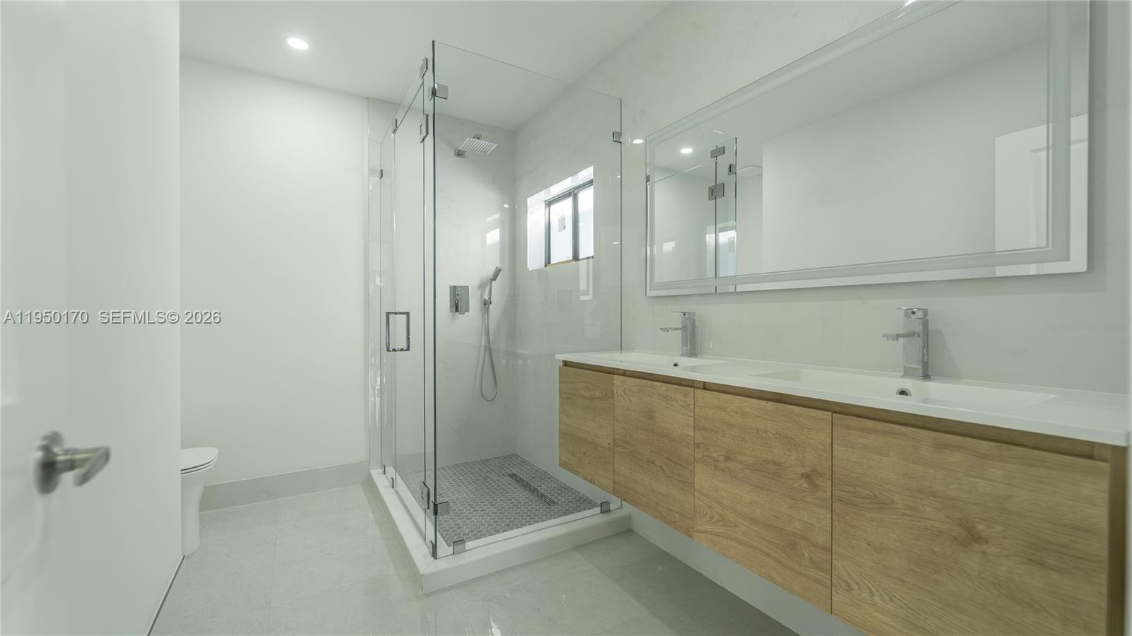 22840 Southwest 122nd Place Miami, FL 33170 - Photo 26 of 36 a bathroom with a shower and a sink