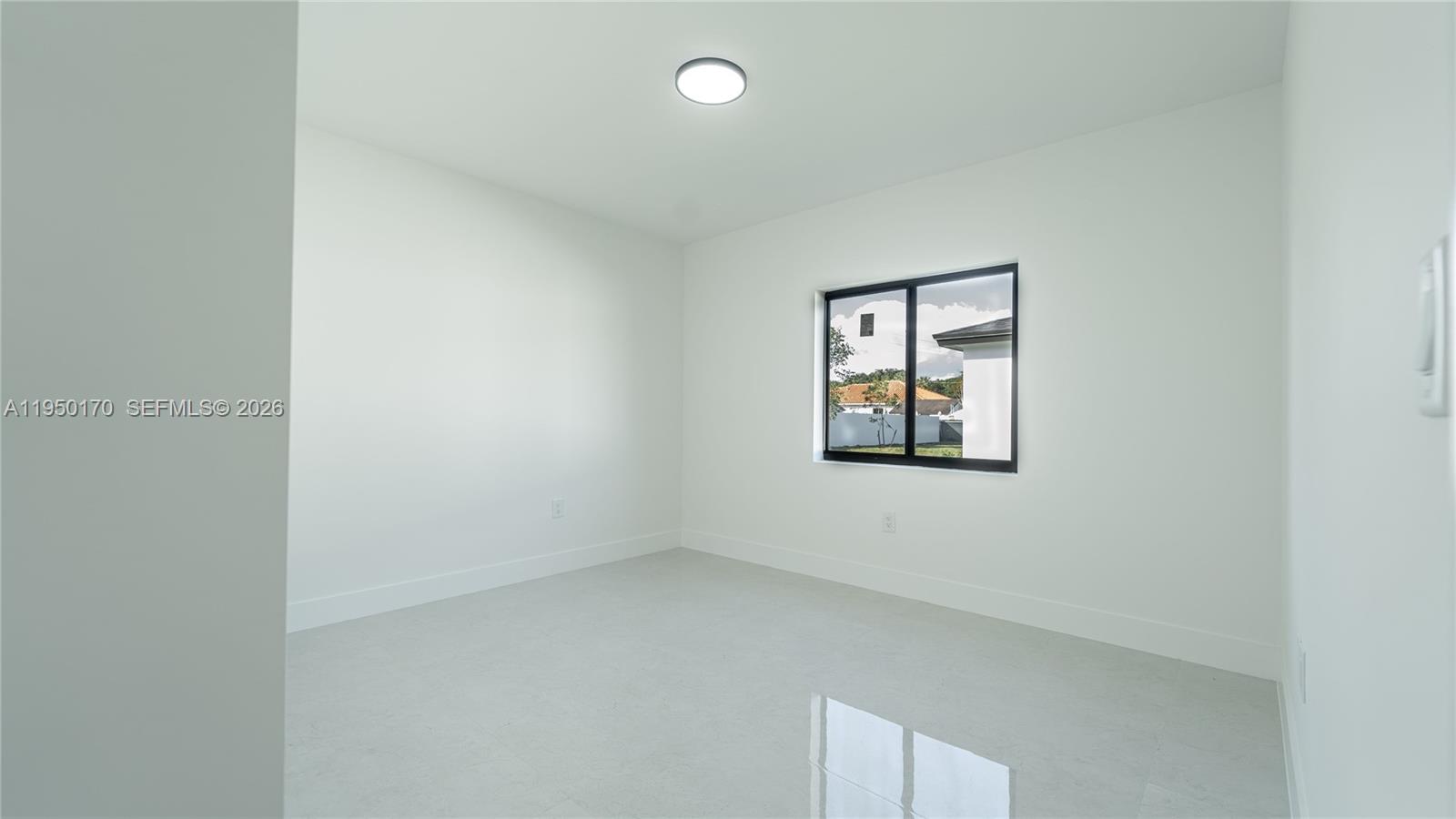 22840 Southwest 122nd Place Miami, FL 33170 - Photo 27 of 36 an empty room with windows