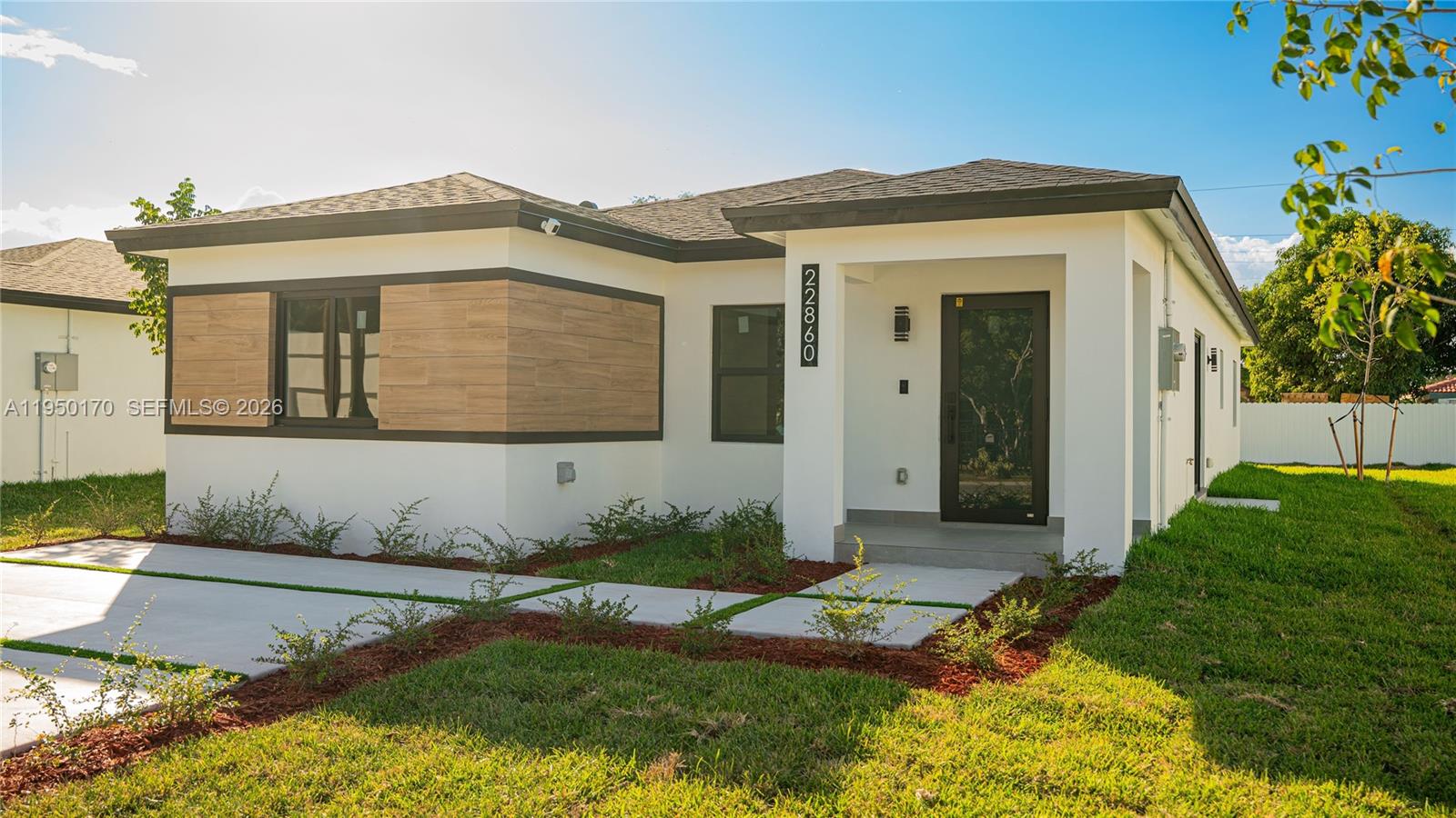 22840 Southwest 122nd Place Miami, FL 33170 - Photo 3 of 36 a front view of a house