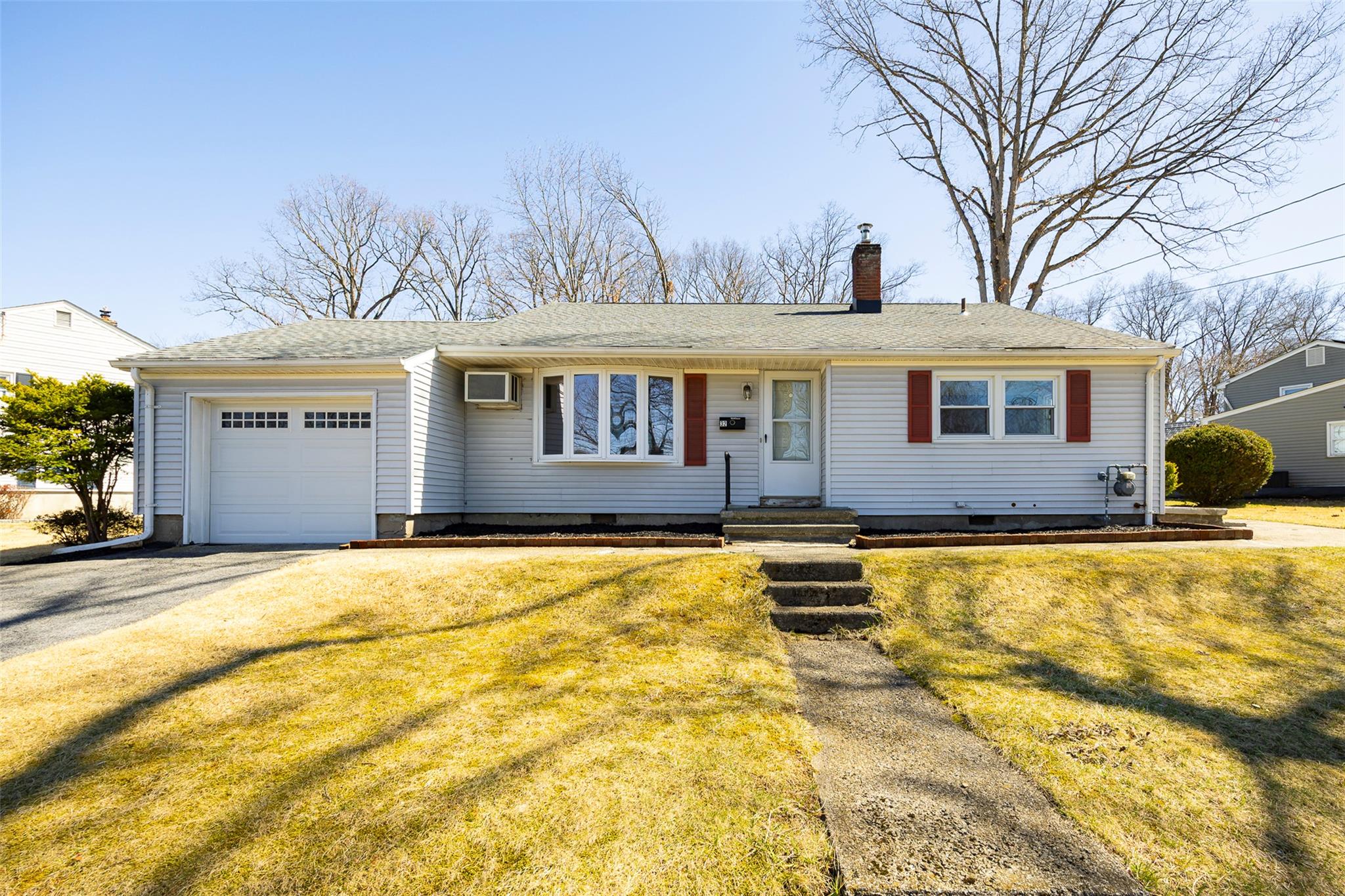 32 Liss Road Wappingers Falls, NY 12590 - Photo 1 of 1 Ranch-style house with an attached garage, a chimney, crawl space, driveway, and an AC wall unit