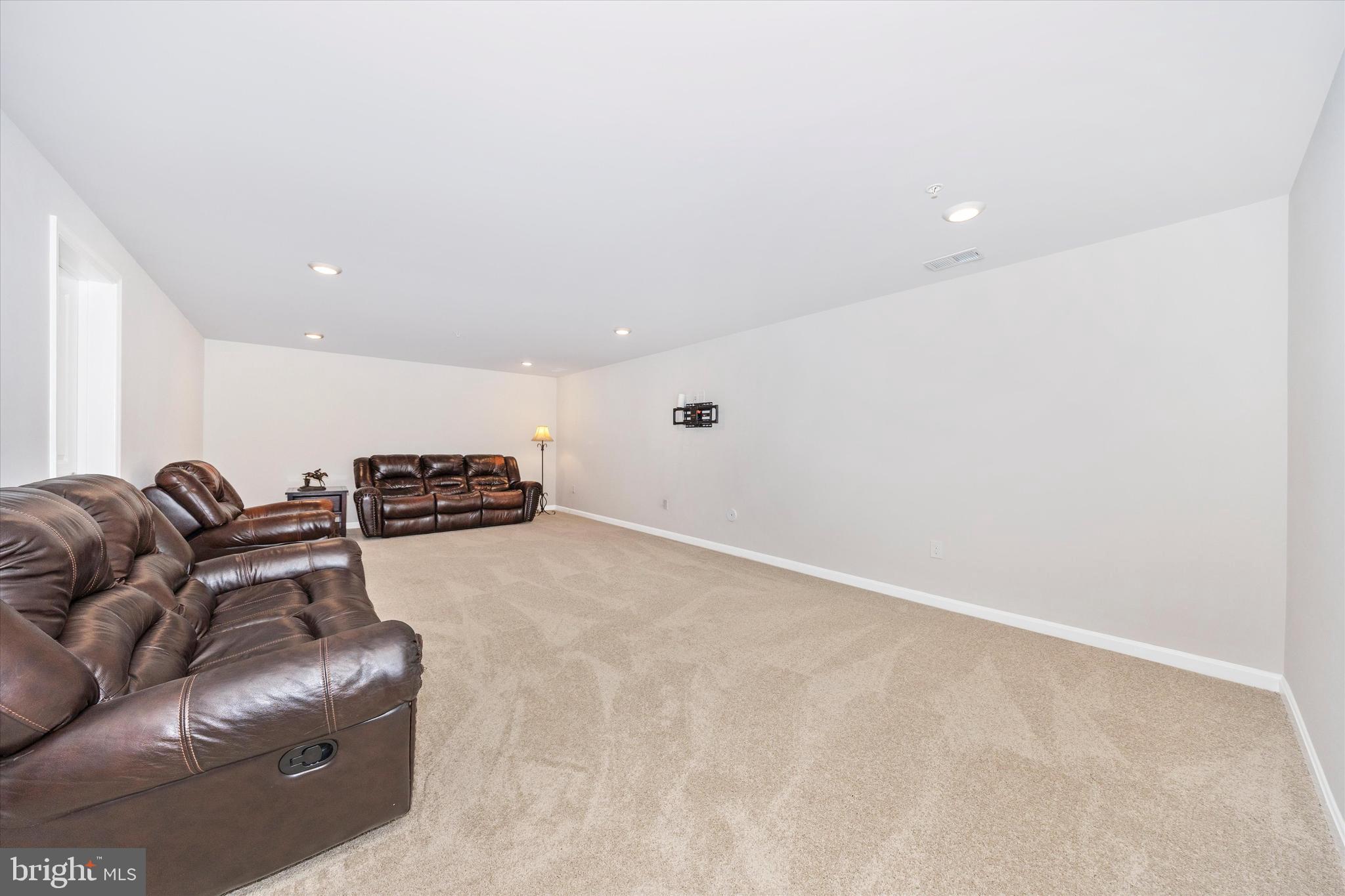 700 Bond Street Frederick, MD 21701 - Photo 33 of 49 a living room with furniture and a couch