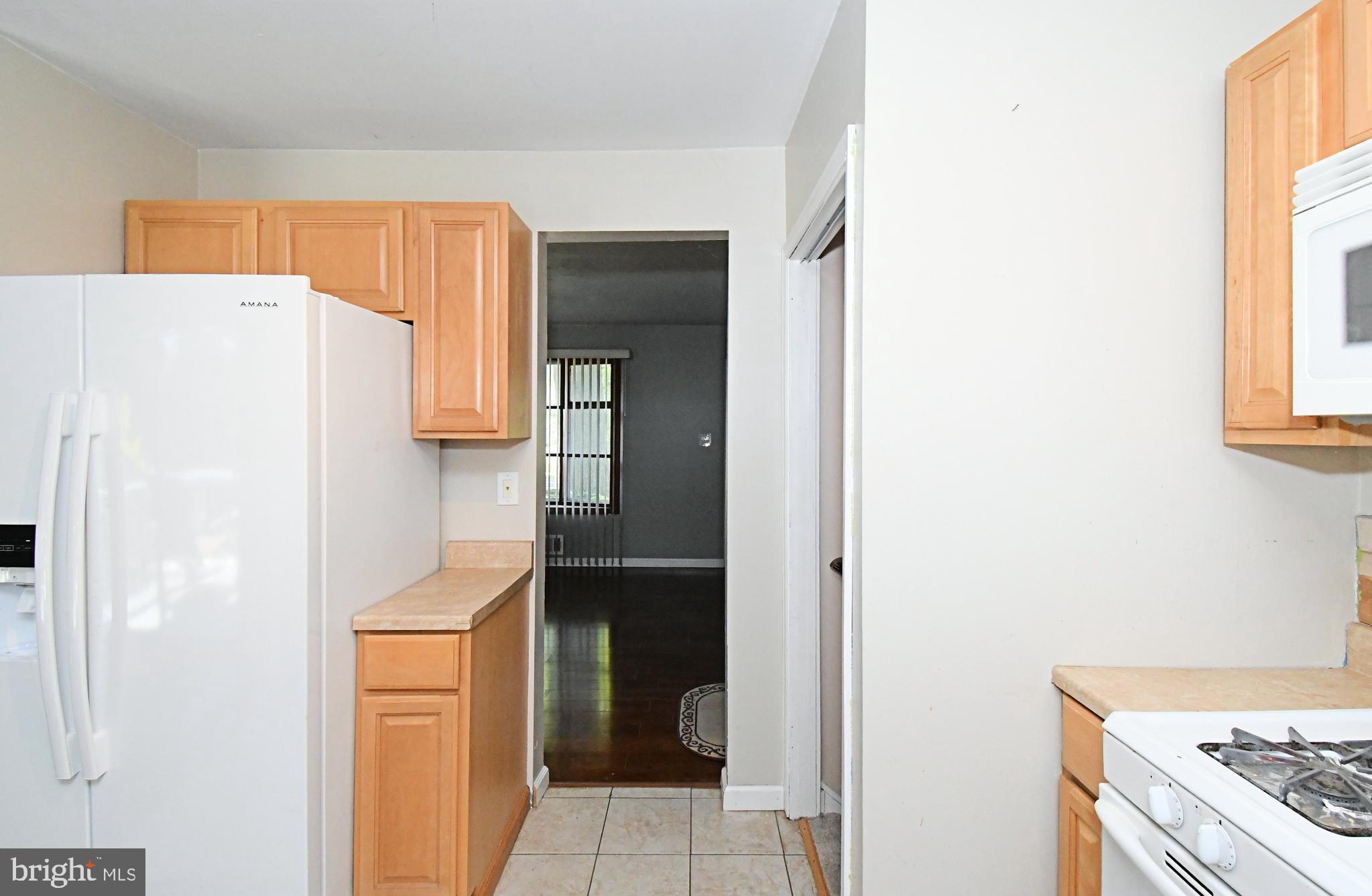 609 Mansfield Road Willow Grove, PA 19090 - Photo 15 of 68 a kitchen with a refrigerator and a stove