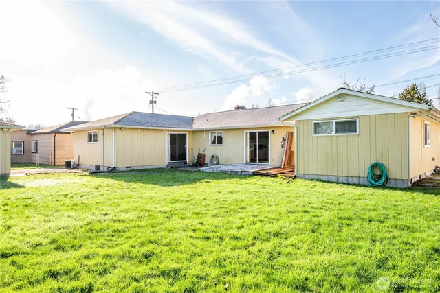 a big house with a big yard and large trees